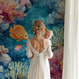 Coral reef wallpaper mural bringing underwater magic to a modern living room with blue accents