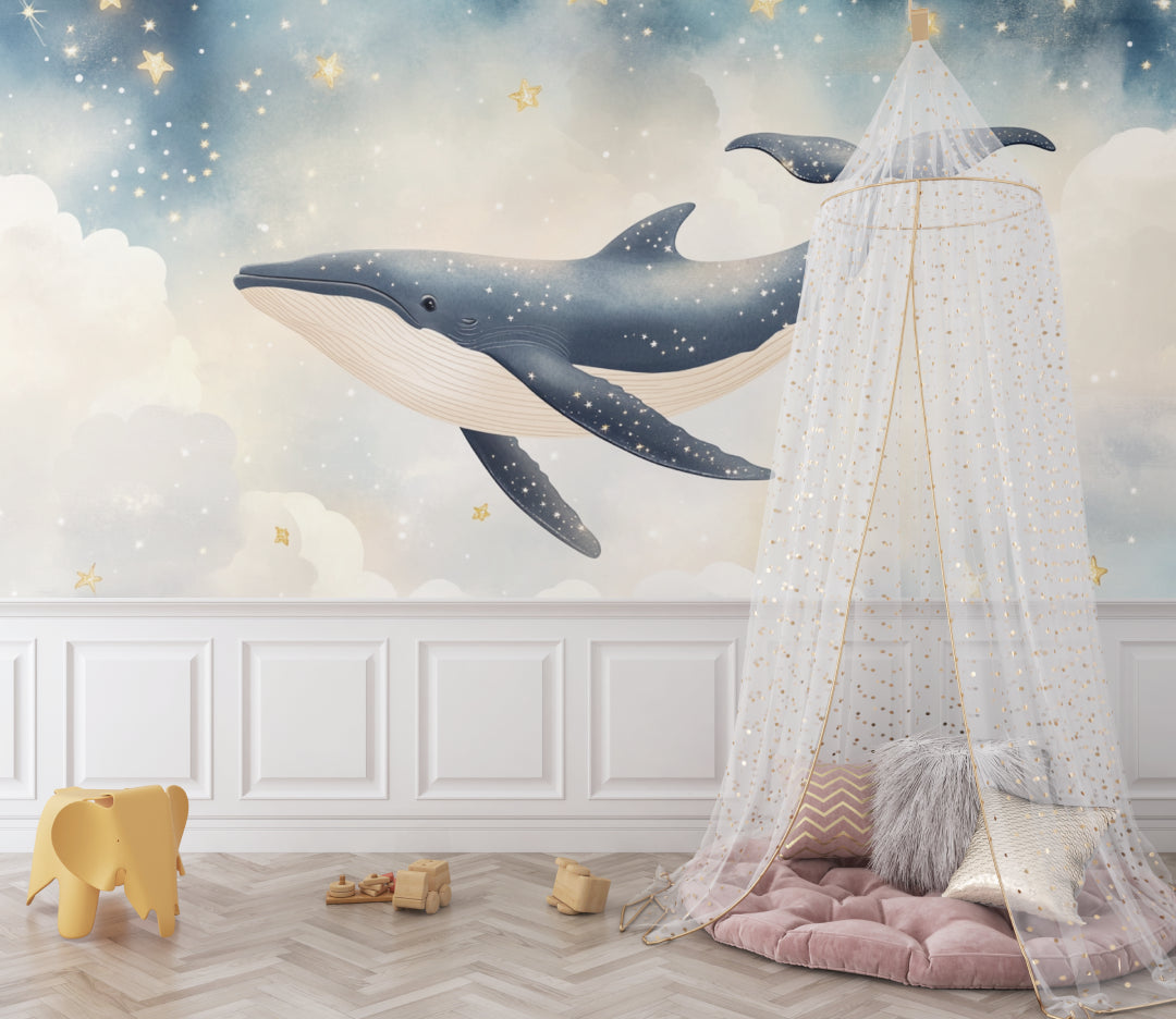 Dreamy whale mural bringing calm to a reading nook with golden star details