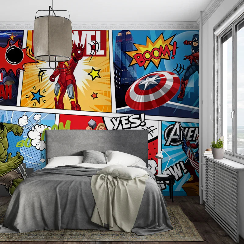 Bedroom with superhero-themed wall art and a gray bed.