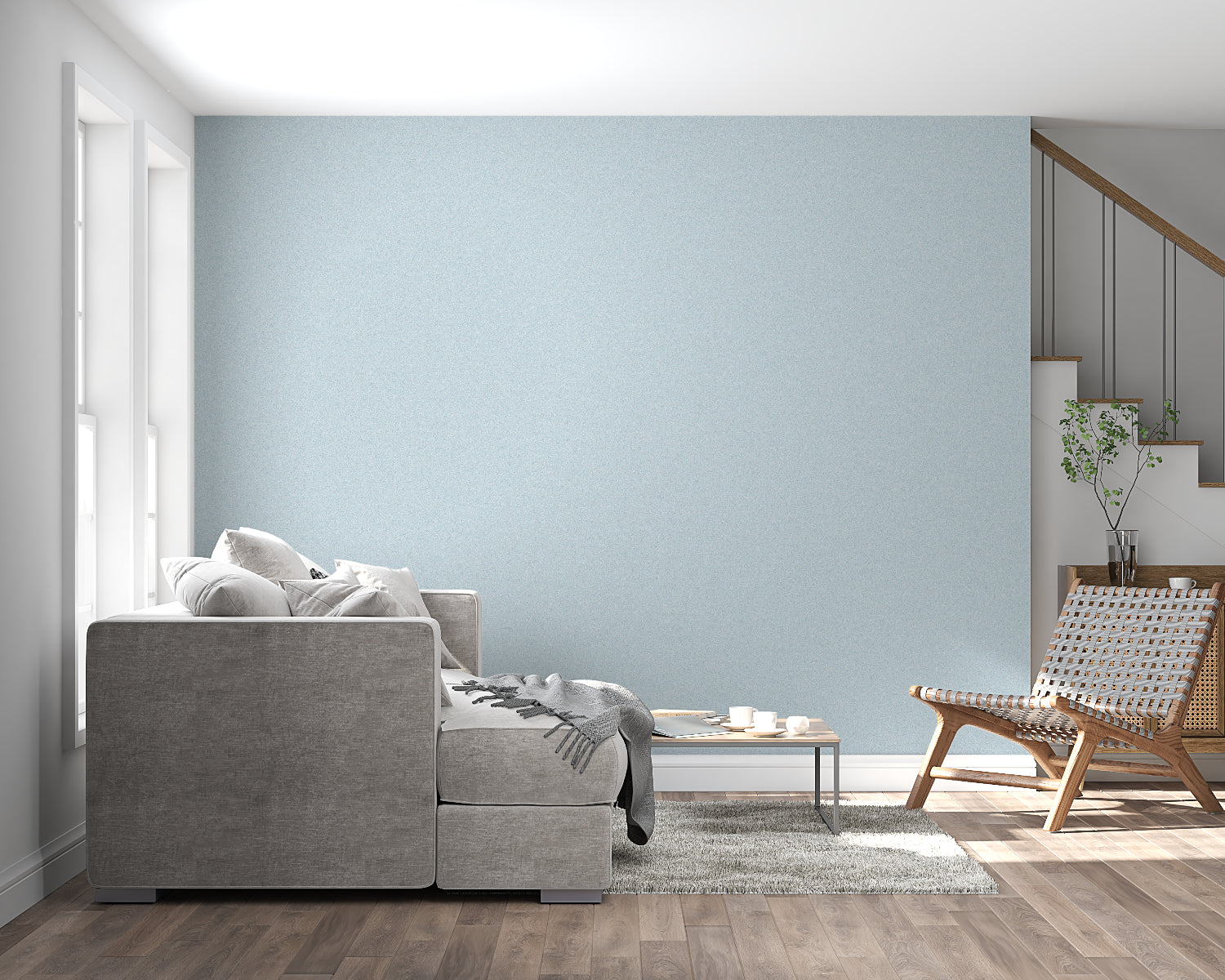Powder blue minimalist wallpaper in modern living room with natural light streaming through windows