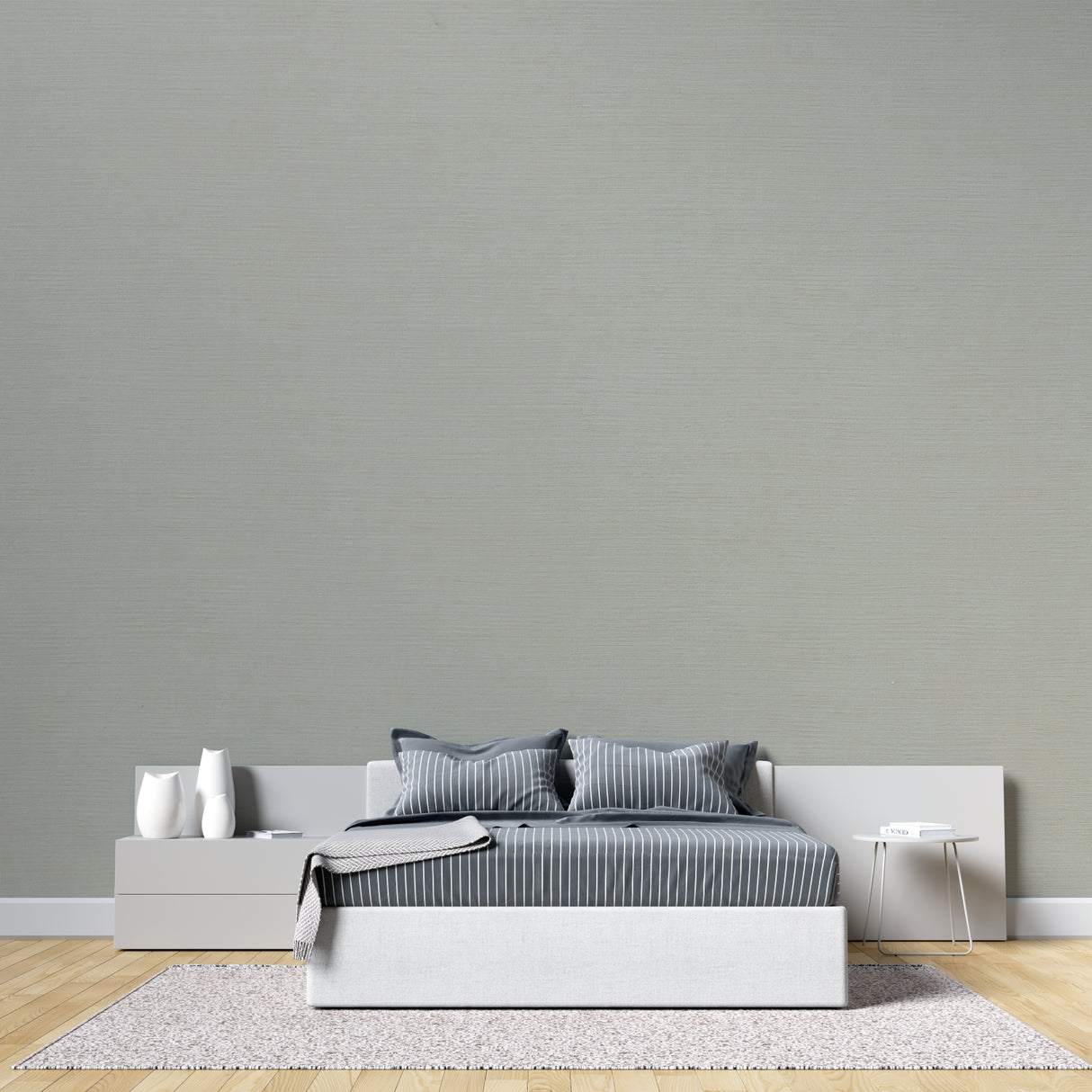 Sage green textured wallpaper in a bright modern living room with minimal furniture and natural light
