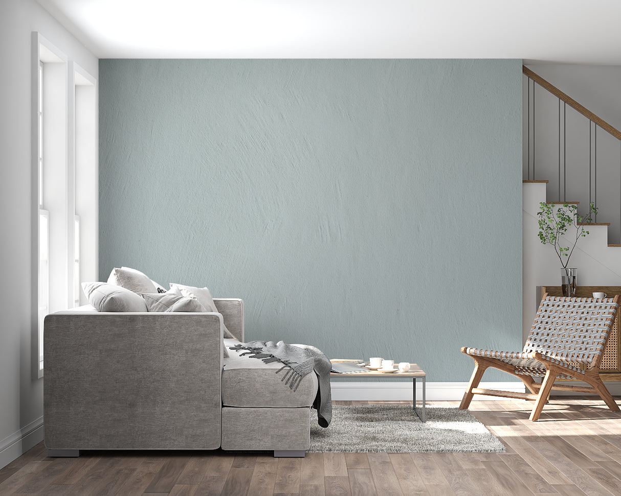 Kitchen accent wall with sage green textured mural complementing white cabinets