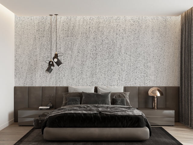 Modern speckled grey wallpaper in a bright living room setting with minimalist furniture