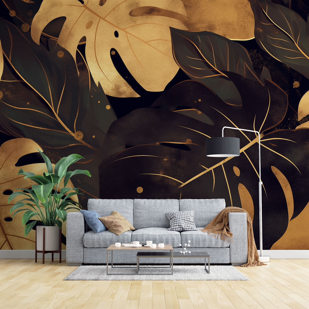 Black and gold Monstera leaf wallpaper creating drama in a modern dining room with pendant lights