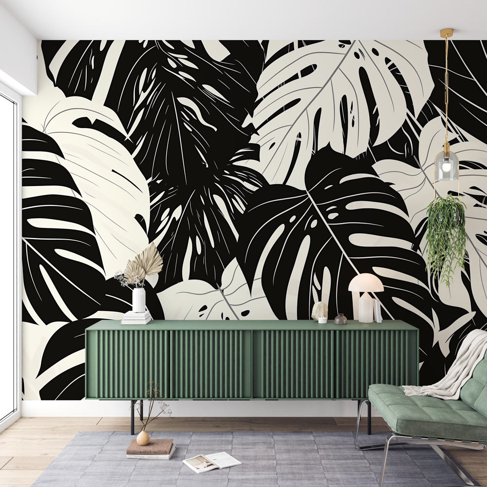 Modern living room featuring black and white Monstera leaf wallpaper, showcasing dramatic tropical pattern against neutral furniture
