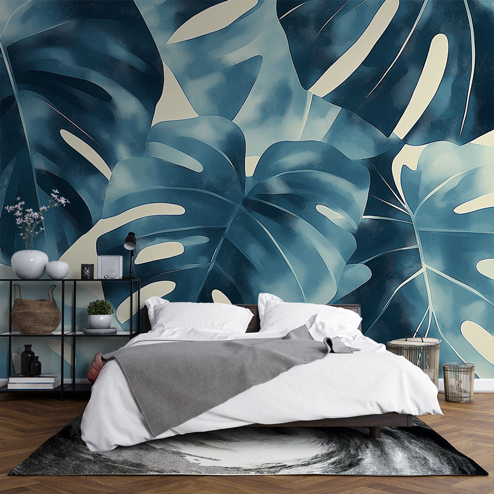 Blue Monstera leaf wallpaper creating a peaceful atmosphere in a modern living room with natural light