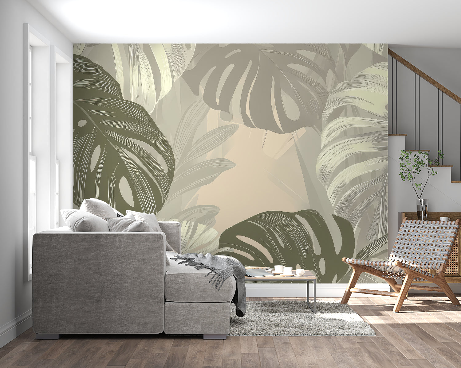 Botanical wall mural with monstera leaves in a home office setting with natural light