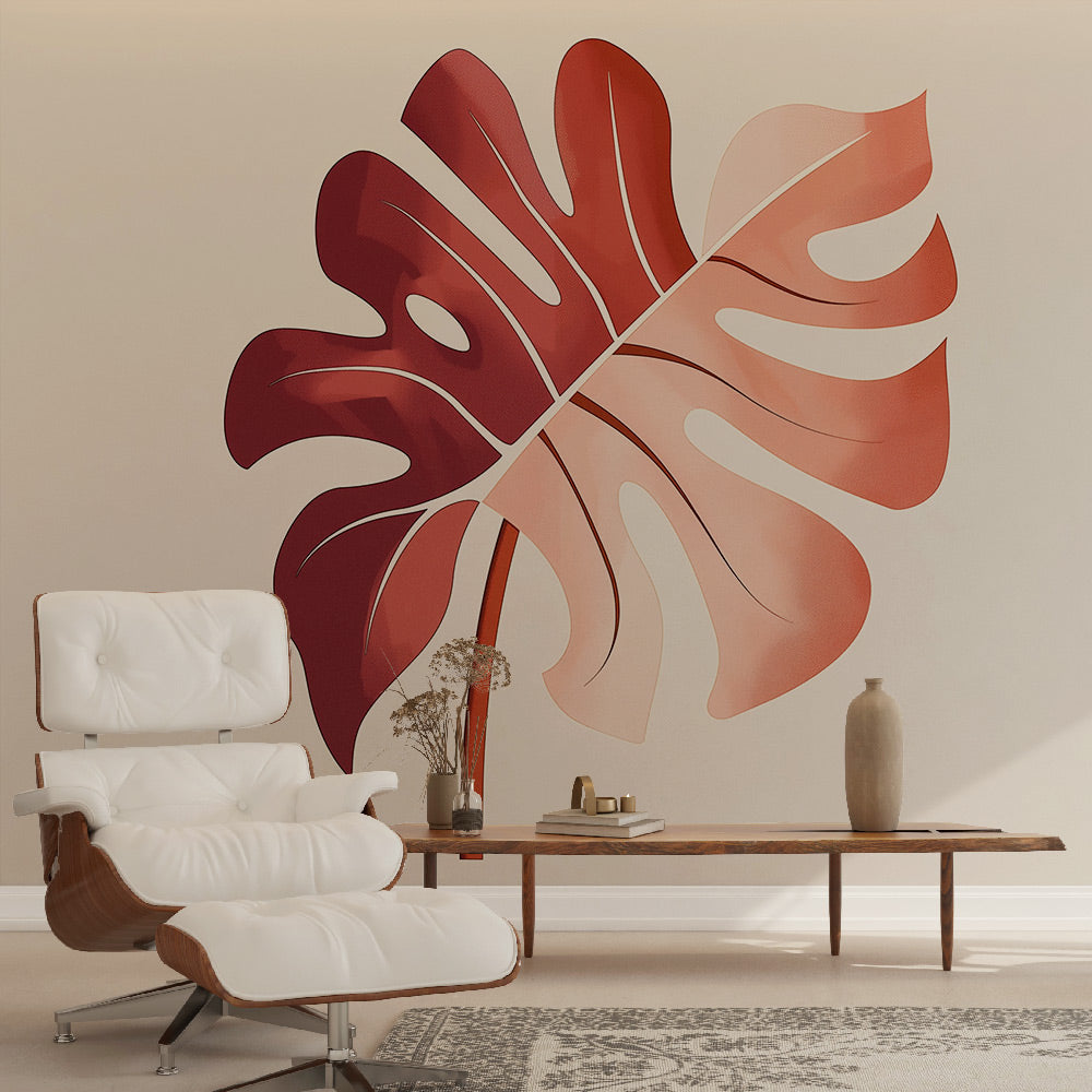 Modern red Monstera leaf wallpaper creating a stunning accent wall in a minimalist living room with natural light