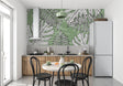 Modern living room with Monstera leaf wallpaper creating a fresh botanical atmosphere