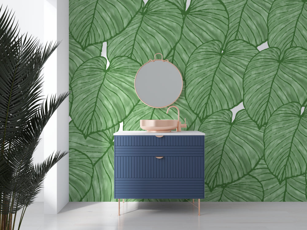 Modern living room with Monstera leaf wallpaper creating a fresh tropical atmosphere