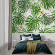 Monstera leaf wallpaper creating a fresh atmosphere in a modern living room with natural light