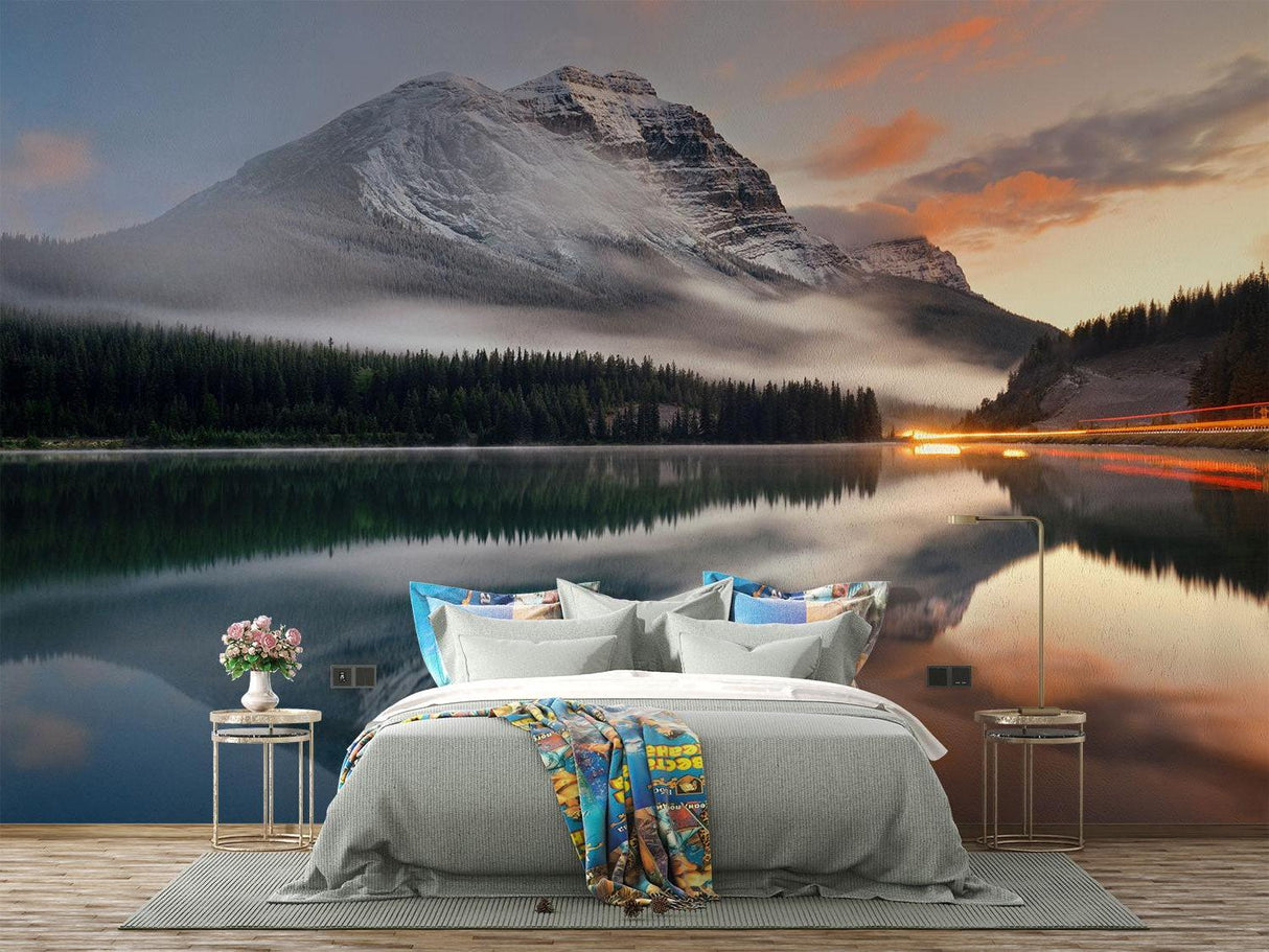 Mountain lake wallpaper in modern living room with gray sofa, showing scale and peaceful atmosphere