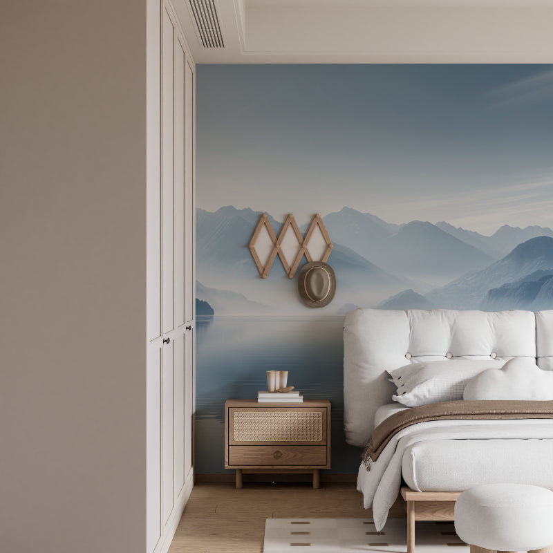 Mountain lake wallpaper creating depth in modern living room with grey sofa and natural light