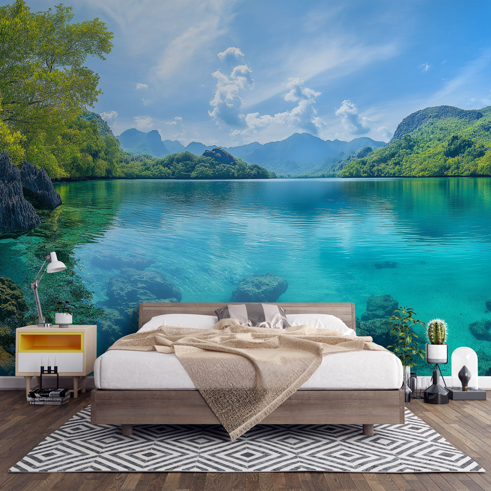 Mountain lake wallpaper mural displayed in bright modern living room, showing turquoise waters and forest landscape