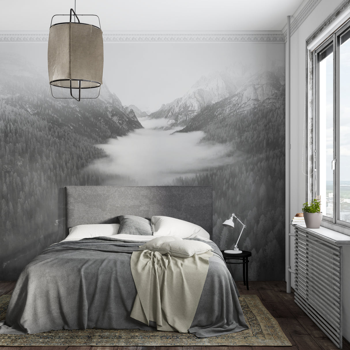 Misty mountain wallpaper making statement in home office with desk and plants