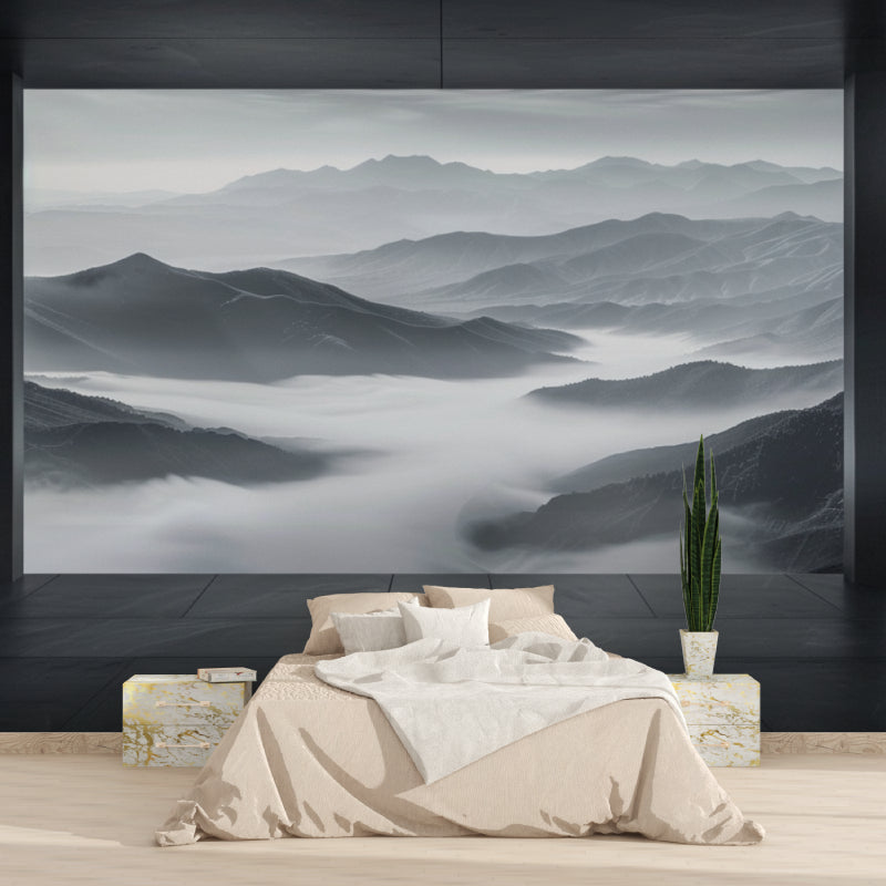 Mountain mist wallpaper creating depth in modern living room with grey sofa and natural light