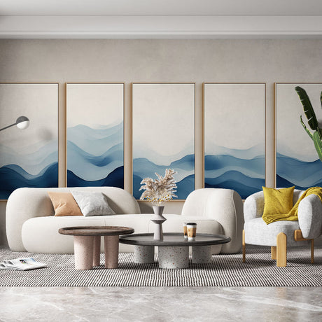 Mountain range wallpaper with blue watercolor waves creating a serene atmosphere in a modern living room setting