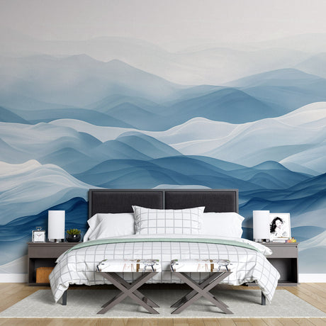 Mountain wall mural in modern living room showing blue abstract waves creating depth against white furniture