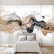 Mountain wallpaper mural in modern living room, showing abstract watercolor design with flying birds