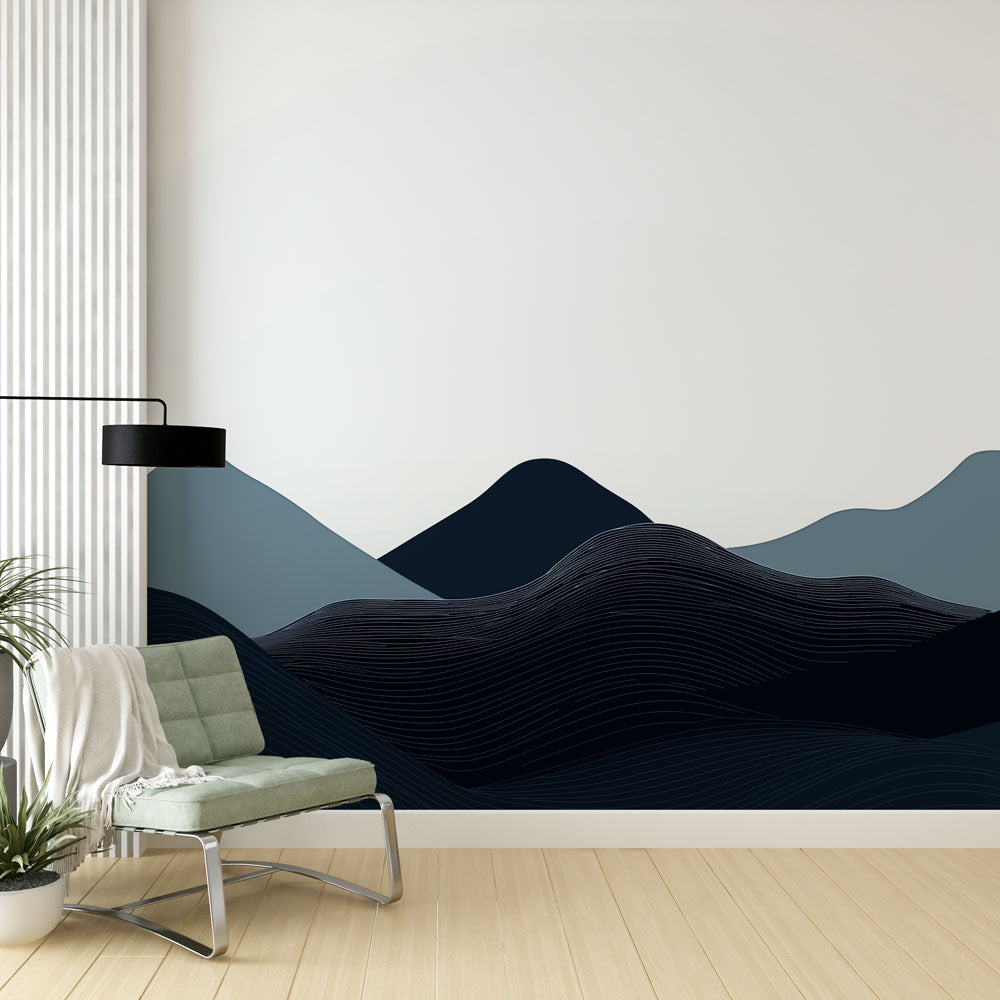 Modern mountain wallpaper with blue wave patterns shown in a minimalist living room setting with contemporary furniture