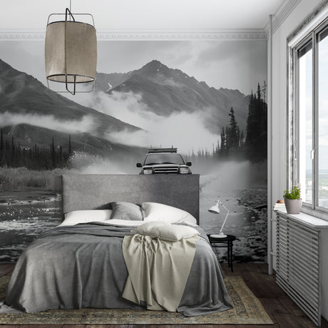Mountain landscape wallpaper in modern living room, adding depth with black and white peaks and misty scenery