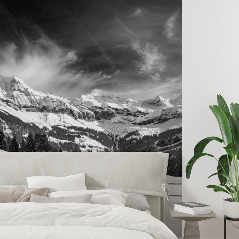Mountain peak wallpaper creating depth in modern living room with minimal furniture