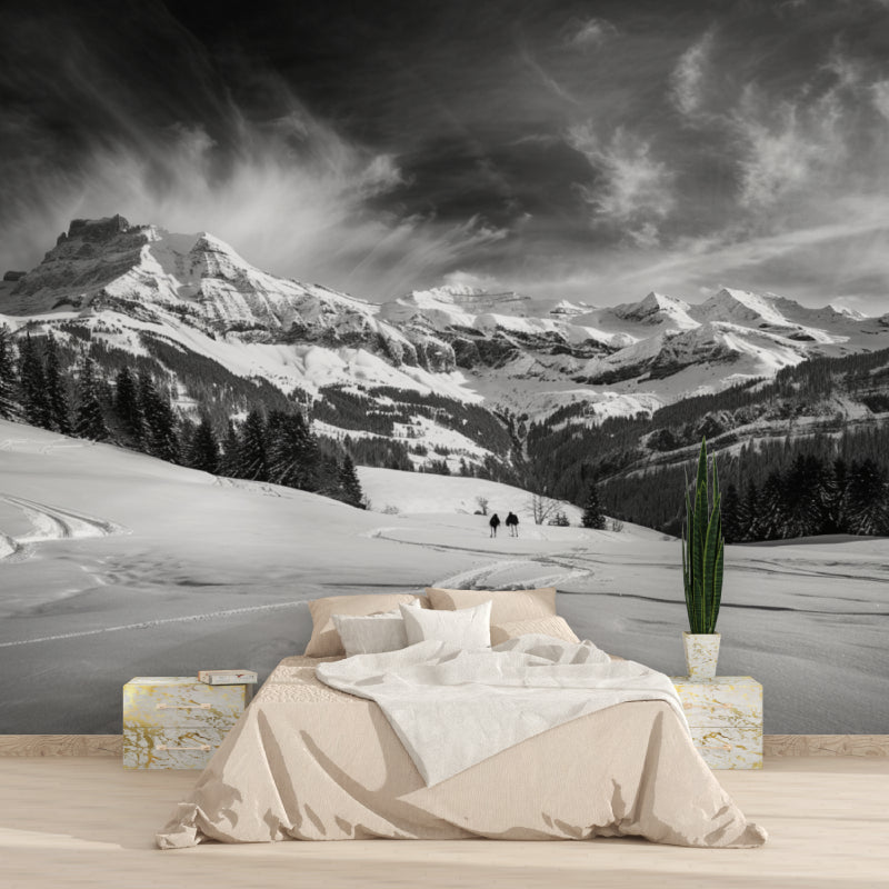 Black and white mountain mural in cozy bedroom setting with natural light