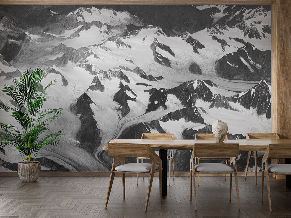 Black and white mountain peak wallpaper in modern living room with minimal furniture