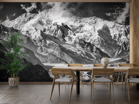 Mountain wallpaper in modern living room, black and white peaks create depth against grey sofa