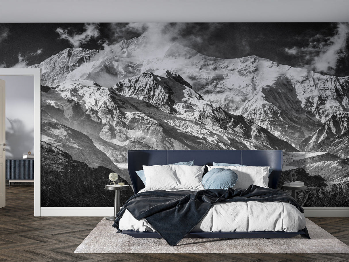 Dramatic mountain wallpaper in home office space with desk and chair