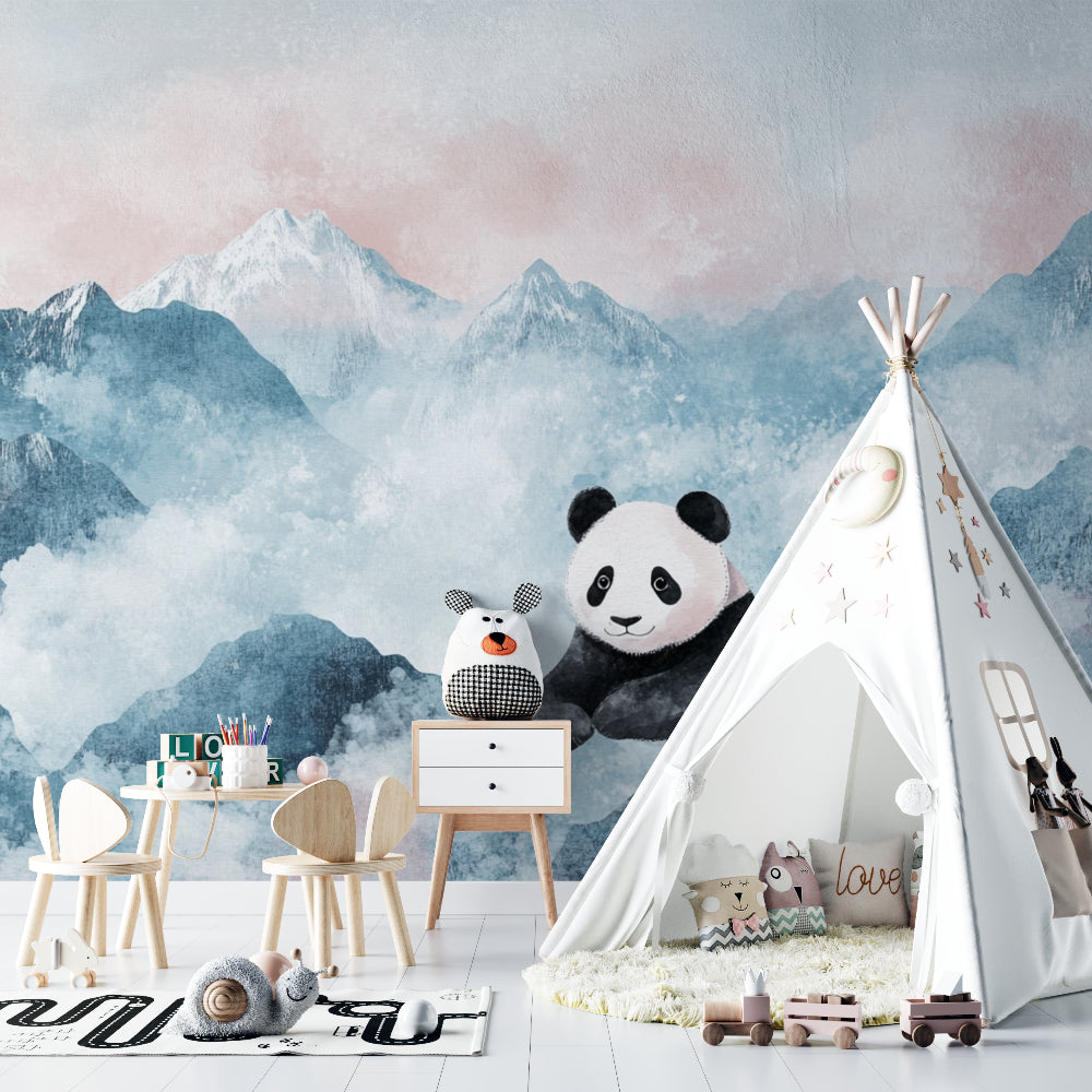 Mountain nursery wallpaper with playful panda shown in modern white nursery with natural wood furniture