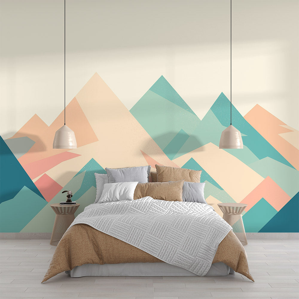 Modern geometric mountain wallpaper in soft pastels styled in a bright Scandinavian living room with minimal furniture