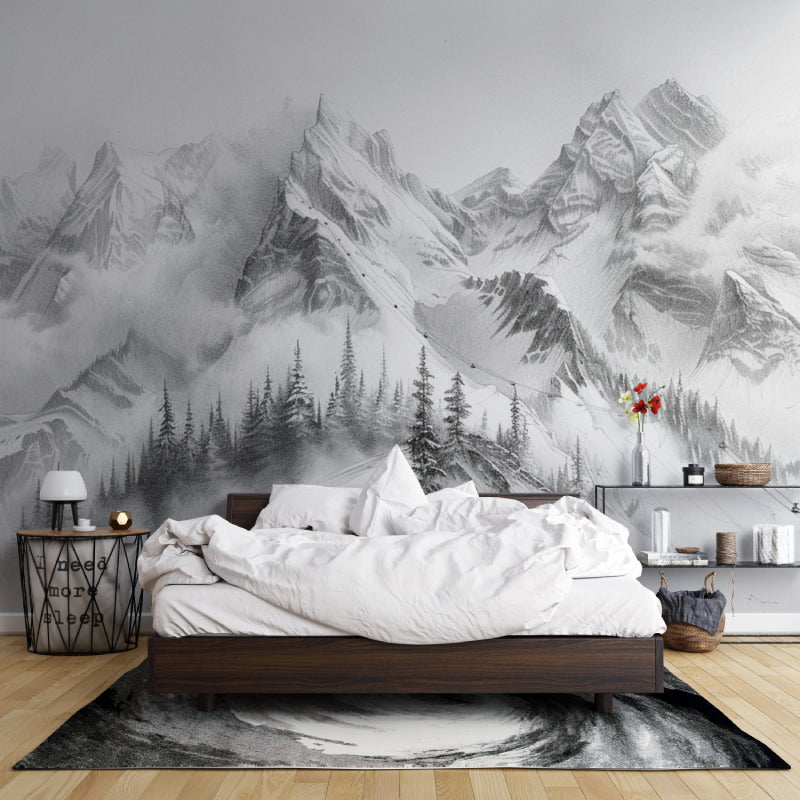 Mountain peak wallpaper creating drama in a modern living room with black and white furniture