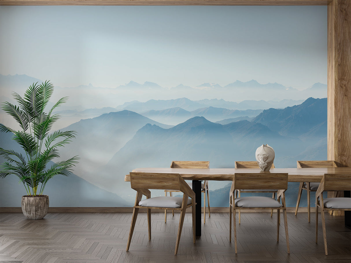Mountain mural wallpaper creating depth in modern living room with grey sofa and natural light