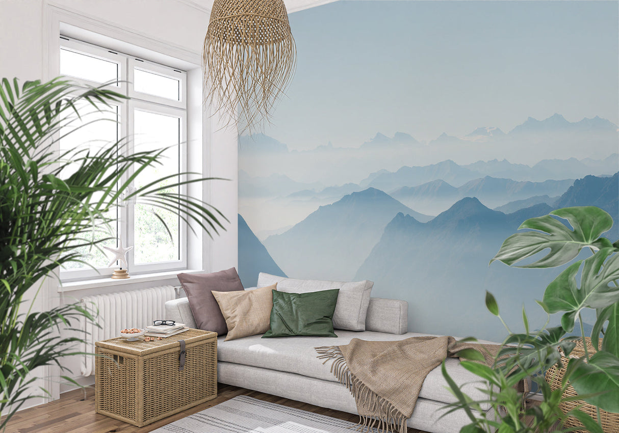 Misty mountain wallpaper in dining room creating atmospheric blue backdrop