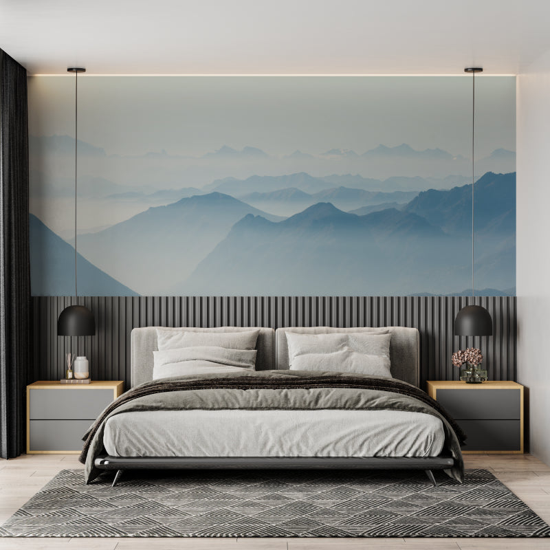 Misty mountain mural creating calm atmosphere in meditation room with floor cushions