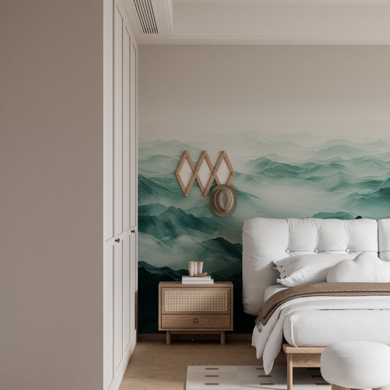 Mountain landscape wallpaper creating depth in modern living room with grey sofa and natural light