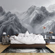 Mountain mural wallpaper creating a calm atmosphere in a modern living room with grey sofa and natural light