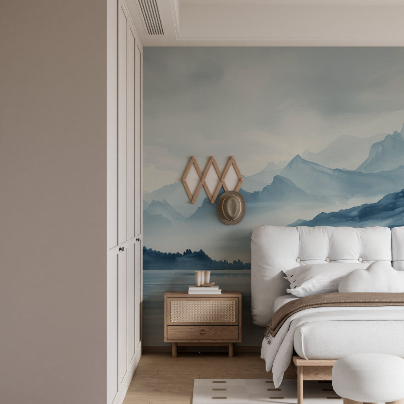 Blue mountain mural in minimalist bedroom setting with natural light