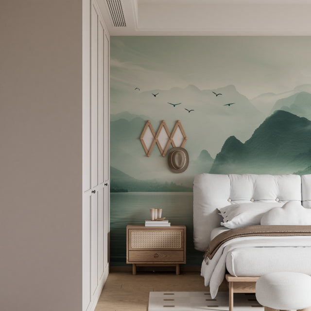 Mountain lake wallpaper in modern living room, showing reflective water and flying birds against misty peaks