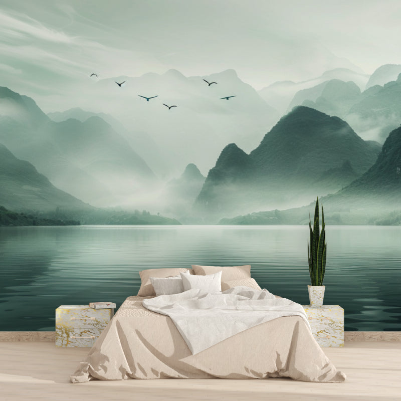 Reading nook with nature wall mural showing misty mountain peaks and calm waters