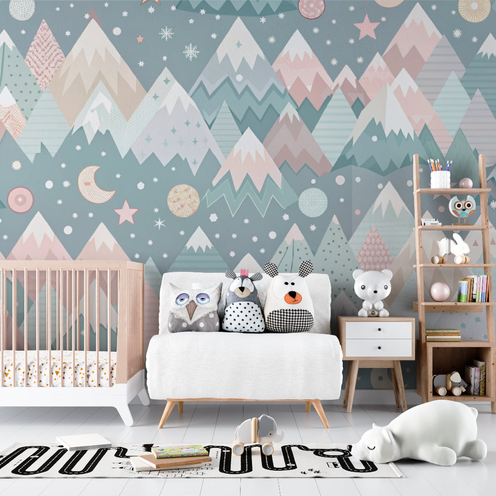 Mountain nursery wallpaper with stars and moon creating a magical atmosphere in a modern nursery with white furniture