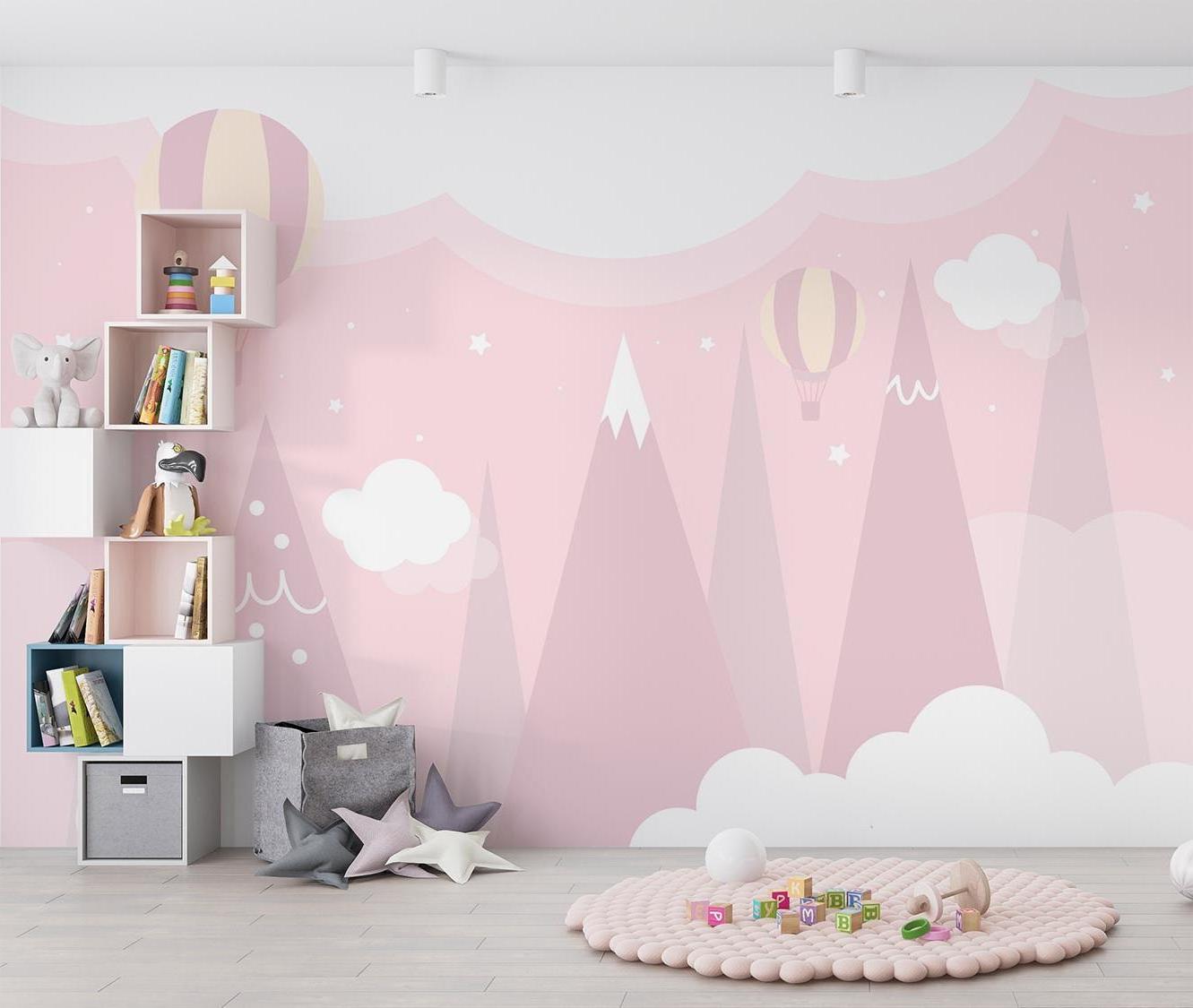 Mountain nursery wallpaper featuring pink peaks and balloons in a cozy children's bedroom setting