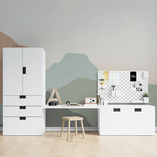 Mountain landscape wallpaper creating a serene atmosphere in a modern living room with minimalist furniture