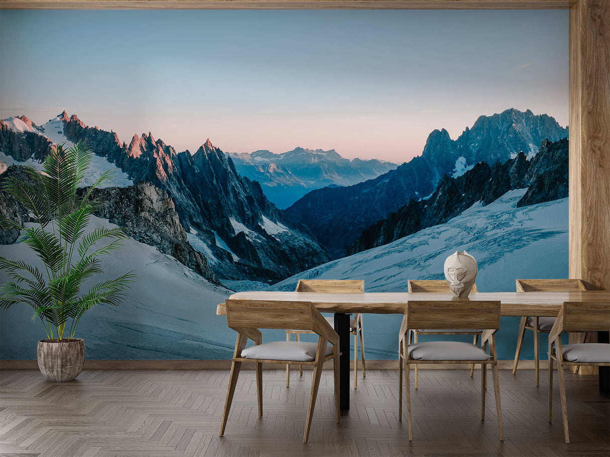 Alpine landscape mural in dining room with pendant lights and wood table