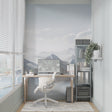 Mountain wall mural in modern living room showing scale of snowy peaks design