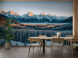 Mountain landscape wallpaper creating depth in modern living room with grey sofa