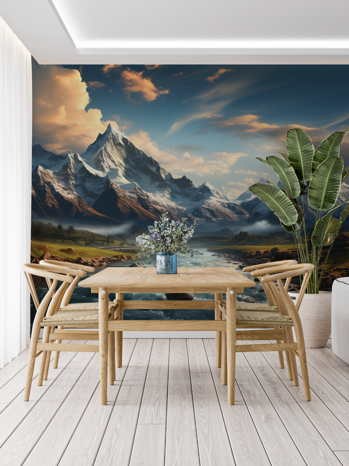 Snowy peaks wallpaper adding depth to a dining room with riverside view