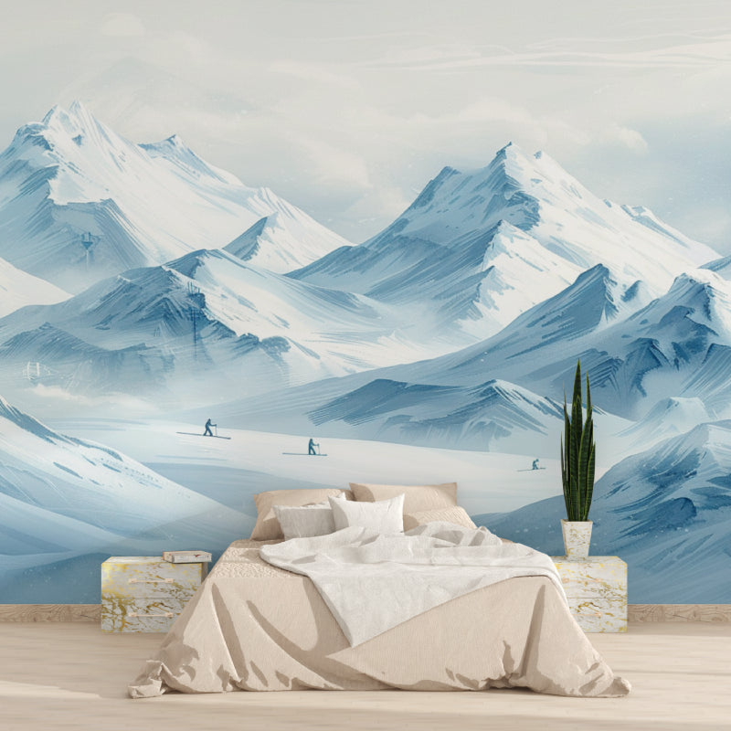 Blue mountain wallpaper in home office showing snowy peaks and skiers