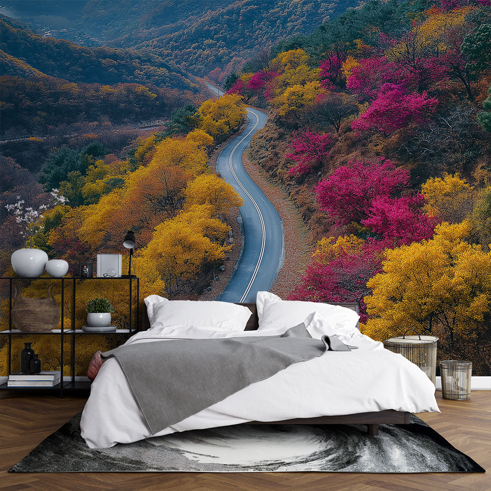 Mountain road wallpaper displayed in a modern living room, showing autumn forest scenery with golden leaves